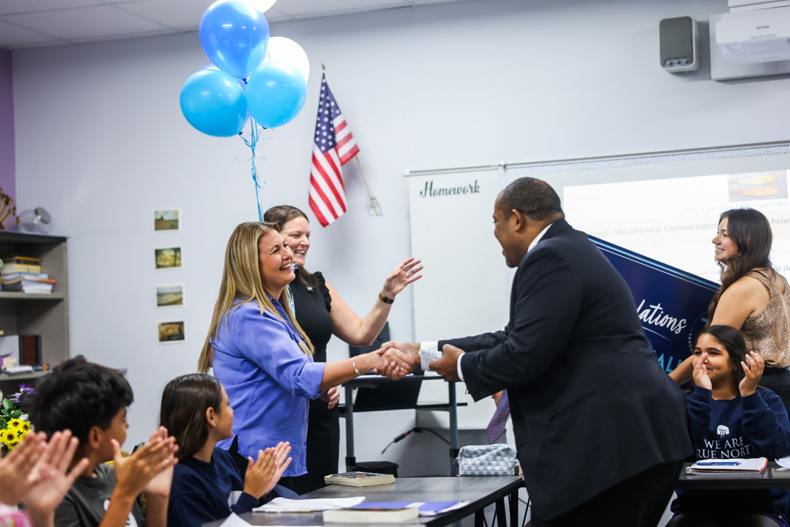 Senior Chancellor Paul Burns congratulates Nicole Leon, one of five finalists for the 2027 Florida Teacher of the Year.